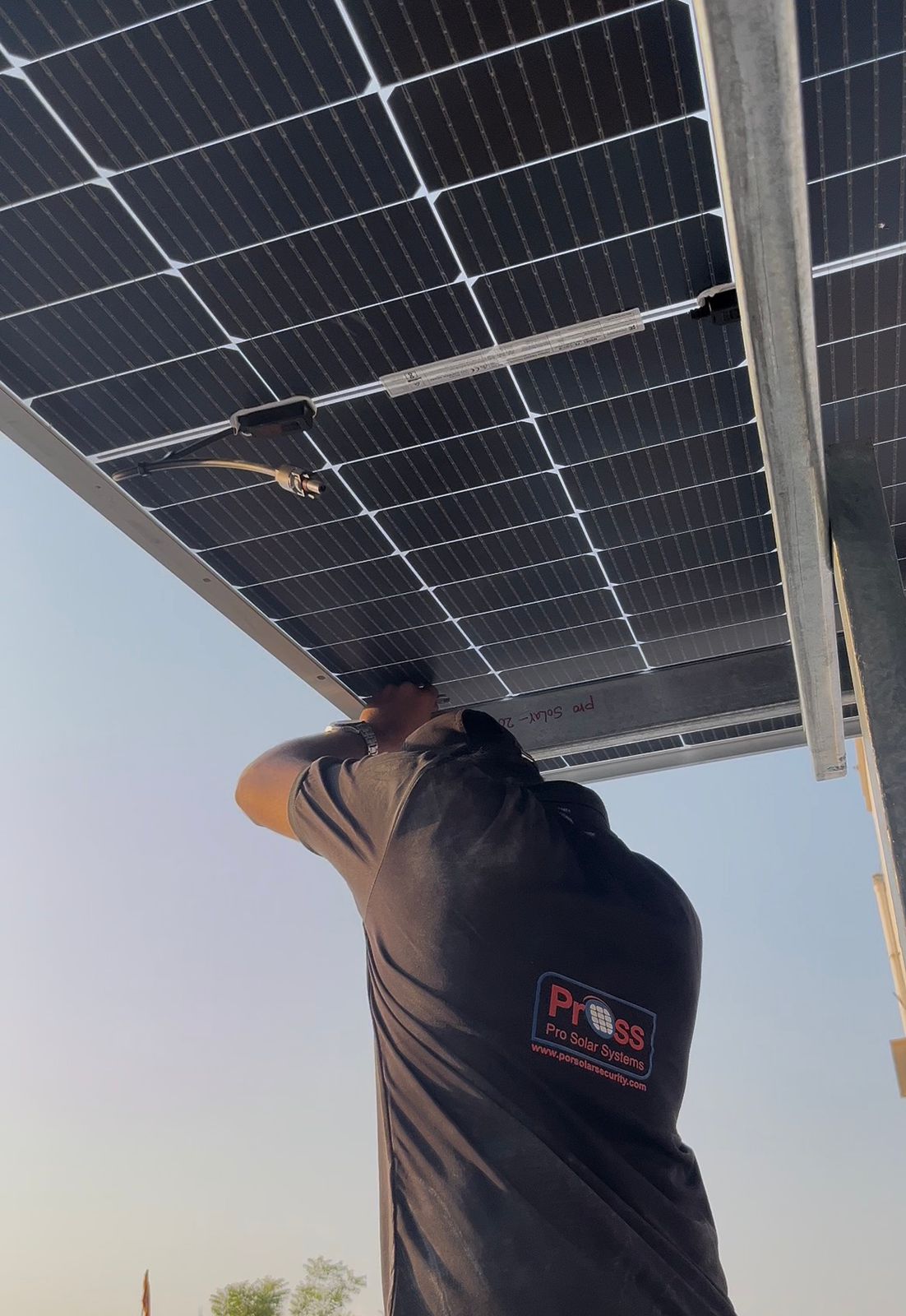 Technicians installing rooftop solar panel mounting structure under PM Surya Ghar Yojana in Hyderabad
